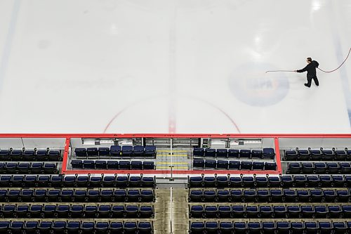 MIKE SUDOMA / FREE PRESS
David Wright paints the ice surface at centre ice white to prepare for Disney on Ice coming up this weekend
Nov 11, 2024


