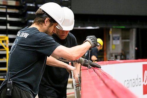 MIKE SUDOMA / FREE PRESS
Keith Rolph and Johann Benediktson pry apart the boards as the crew prepares for the Bruce Springsteen show Wednesday evening
Nov 13, 2024


