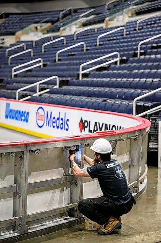 MIKE SUDOMA / FREE PRESS
Lead hand Keith Rolph dismantles the boards as the crew prepares for the Bruce Springsteen show Wednesday evening
Nov 13, 2024


