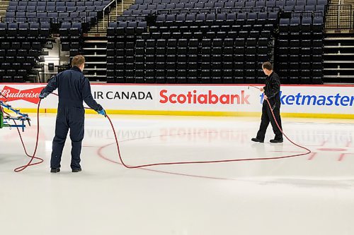 MIKE SUDOMA / FREE PRESS
Engineers Ryan Jones (left) and David Wright (right) paints the ice surface at centre ice white to prepare for Disney on Ice coming up this weekend
Nov 11, 2024


