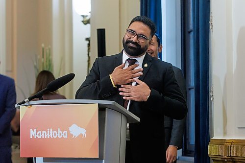 MIKE DEAL / FREE PRESS
Mintu Sandhu (MLA for The Maples) is sworn in as the minister of public service delivery.
Premier Wab Kinew expanded and shuffled his cabinet after a year in office during a ceremony Wednesday morning at the Manitoba Legislative Building. Mike Moroz, the MLA for River Heights, will lead the department of innovation and new technology, an entirely new division. The other two new members of cabinet are Mintu Sandhu (the Maples), who is now minister of the delivery of public services, and Nellie Kennedy (Assiniboia), who is now minister of sport, culture, heritage and tourism.
Jamie Moses (St. Vital) is now minister of business, mining, trade and job creation.
lan Bushie (Keewatinook) is now minister of natural resources. He remains the minister of Indigenous economic development.
Glen Simard (Brandon East) is now minister of municipal and northern relations.
Lisa Naylor (Wolseley) remains minister of transportation and infrastructure but is no longer minister of consumer protection and government services, the news release stated.
Including the premier, there are now 19 cabinet members.
Reporter: Carol Sanders
241113 - Wednesday, November 13, 2024.