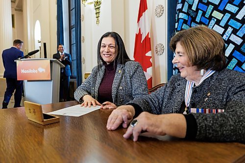 MIKE DEAL / FREE PRESS
Nellie Kennedy (Assiniboia), is sworn in as minister of sport, culture, heritage and tourism signing a document with Lt.-Gov. Anita Neville as witness.
Premier Wab Kinew expanded and shuffled his cabinet after a year in office during a ceremony Wednesday morning at the Manitoba Legislative Building. Mike Moroz, the MLA for River Heights, will lead the department of innovation and new technology, an entirely new division. The other two new members of cabinet are Mintu Sandhu (the Maples), who is now minister of the delivery of public services, and Nellie Kennedy (Assiniboia), who is now minister of sport, culture, heritage and tourism.
Jamie Moses (St. Vital) is now minister of business, mining, trade and job creation.
lan Bushie (Keewatinook) is now minister of natural resources. He remains the minister of Indigenous economic development.
Glen Simard (Brandon East) is now minister of municipal and northern relations.
Lisa Naylor (Wolseley) remains minister of transportation and infrastructure but is no longer minister of consumer protection and government services, the news release stated.
Including the premier, there are now 19 cabinet members.
Reporter: Carol Sanders
241113 - Wednesday, November 13, 2024.