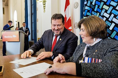 MIKE DEAL / FREE PRESS
Glen Simard (Brandon East) is sworn in as minister of municipal and northern relations signing a document with Lt.-Gov. Anita Neville as witness.
Premier Wab Kinew expanded and shuffled his cabinet after a year in office during a ceremony Wednesday morning at the Manitoba Legislative Building. Mike Moroz, the MLA for River Heights, will lead the department of innovation and new technology, an entirely new division. The other two new members of cabinet are Mintu Sandhu (the Maples), who is now minister of the delivery of public services, and Nellie Kennedy (Assiniboia), who is now minister of sport, culture, heritage and tourism.
Jamie Moses (St. Vital) is now minister of business, mining, trade and job creation.
lan Bushie (Keewatinook) is now minister of natural resources. He remains the minister of Indigenous economic development.
Glen Simard (Brandon East) is now minister of municipal and northern relations.
Lisa Naylor (Wolseley) remains minister of transportation and infrastructure but is no longer minister of consumer protection and government services, the news release stated.
Including the premier, there are now 19 cabinet members.
Reporter: Carol Sanders
241113 - Wednesday, November 13, 2024.