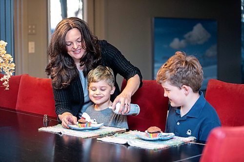 MIKAELA MACKENZIE / FREE PRESS
	
Desirae Mercer and her children, Jacob Reimer (eight) and Zavier Reimer (five), eat a vegan dessert on Wednesday, Nov. 13, 2024. Mercer feels that raising her kids vegan helps them to think more about the foods they eat, about where their toys and clothes come from, and their impact on the planet. 

For Janine green page story.
Winnipeg Free Press 2024