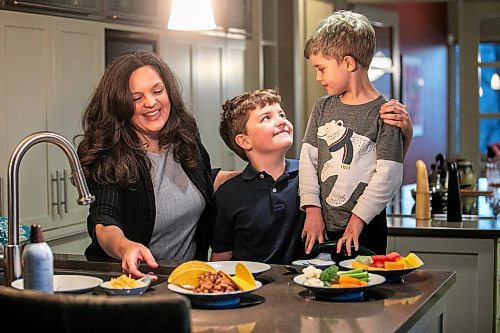 MIKAELA MACKENZIE / FREE PRESS
	
Desirae Mercer and her children, Jacob Reimer (eight) and Zavier Reimer (five), prepare bean tacos on Wednesday, Nov. 13, 2024. Mercer feels that raising her kids vegan helps them to think more about the foods they eat, about where their toys and clothes come from, and their impact on the planet. 

For Janine green page story.
Winnipeg Free Press 2024