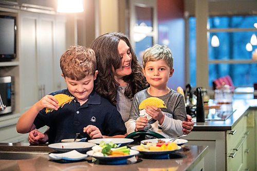 MIKAELA MACKENZIE / FREE PRESS
	
Desirae Mercer and her children, Jacob Reimer (eight) and Zavier Reimer (five), prepare bean tacos on Wednesday, Nov. 13, 2024. Mercer feels that raising her kids vegan helps them to think more about the foods they eat, about where their toys and clothes come from, and their impact on the planet. 

For Janine green page story.
Winnipeg Free Press 2024