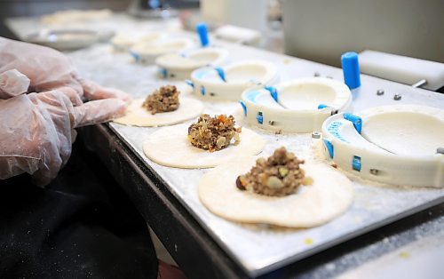 RUTH BONNEVILLE / FREE PRESS

NTERSECTION - Cafe Lima

La Salle Community Centre

Photos of Jonatan Laos Zegarra, owner Cafe Lima, making his famous empanadas in a commercial kitchen in La Salle Wednesday.  

Intersection piece on Jonatan, who started an empanada biz in July 2023.  It's a home-based operation selling six varieties of empanadas. Jonatan grew up in Lima, Peru and met his future wife while attending U of M in 2018. He lost his job in the spring of 2023 and decided to go into business for himself, selling Peruvian-flavoured empanadas. He'd love to have a bricks-and-mortar spot of his own one day, as his name implies, but he's been kept so busy baking for farmer's markets &amp; pop-up sales, that he barely has time for that, at this point - he sells out, almost every time out. 


Dave Sanderson story
 For Nov 16 Intersection 

Nov 13th, 2024