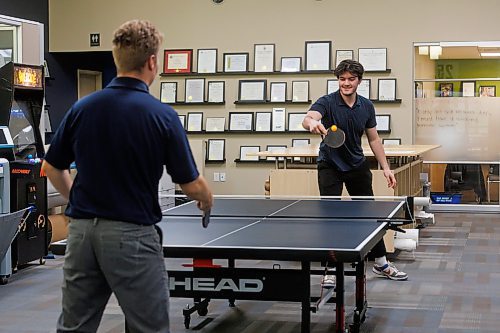 MIKE DEAL / FREE PRESS
Tower Engineering (1140 Waverley St.), a 27-year-old firm with offices in Winnipeg and Calgary.
Noah Shotton (right) a drafter with Tower Engineering, plays a game of ping pong with Tyson Nelson an engineer in training (EIT) during a break Wednesday afternoon.
Reporter: Aaron Epp
241113 - Wednesday, November 13, 2024.