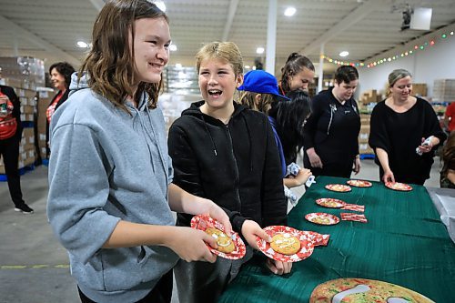 RUTH BONNEVILLE / FREE PRESS

LOCAL Standup - cheer board

Students from General Vanier School in grades 7 &amp; 8 pack food hampers together in a chain and also decorate Smile Cookies to officially marks the beginning of the Christmas Cheer Board season Thursday. 

Cheer Board and Tim Hortons celebrate working together in support our community with the sale of Smile Cookies starting on Nov 18th. 

Nov 14th, 2024