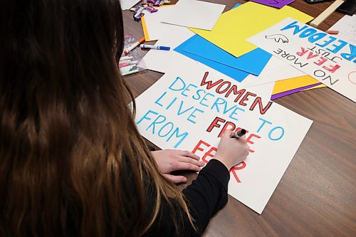 14112024
Kelsey Crandall with the Women&#x2019;s Resource Centre creates signs and placards with coworkers on Thursday afternoon for marchers to carry during Thursday evening&#x2019;s Take Back The Night march. November marks Domestic Violence Awareness Month and the annual march brings attention to gender-based and sexual violence. (Tim Smith/The Brandon Sun)