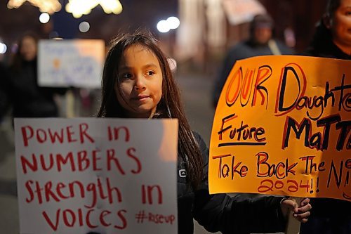 14112024
Nine-year-old Lexi Francois carries placards while taking part in the annual Take Back The Night March in Brandon on Thursday evening. After speakers and drumming at Princess Park, marchers walked along Princess Avenue to Brandon University. November marks Domestic Violence Awareness Month and the annual march brings attention to gender-based and sexual violence. (Tim Smith/The Brandon Sun)