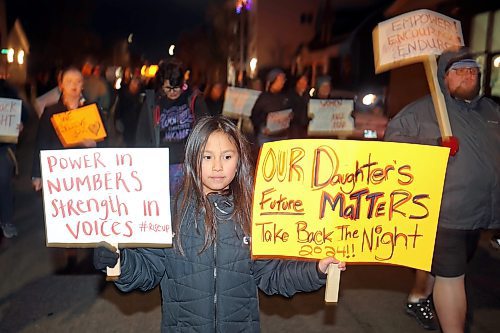 14112024
Nine-year-old Lexi Francois carries placards while taking part in the annual Take Back The Night March in Brandon on Thursday evening. After speakers and drumming at Princess Park, marchers walked along Princess Avenue to Brandon University. November marks Domestic Violence Awareness Month and the annual march brings attention to gender-based and sexual violence. (Tim Smith/The Brandon Sun)