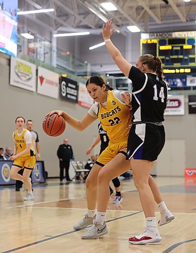 Jayna Maytwayashing of the Brandon University Bobcats backs down Abby Stonehocker of the Lethbridge Pronghorns during their Canada West women's basketball game at the Healthy Living Centre on Friday evening. (Tim Smith/The Brandon Sun)