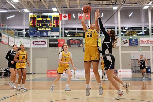 Jayna Maytwayashing of the Brandon University Bobcats leaps to take a shot on net during university women’s basketball action against the University of Lethbridge Pronghorns at the BU Healthy Living Centre on Friday evening. 
(Tim Smith/The Brandon Sun)