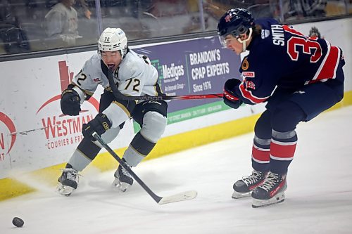 Marcus Nguyen #72 of the Brandon Wheat Kings takes a stick to the mouth from Brayden Smith #36 of the Regina Pats during WHL action at Westoba Place on Friday evening. 
(Tim Smith/The Brandon Sun)