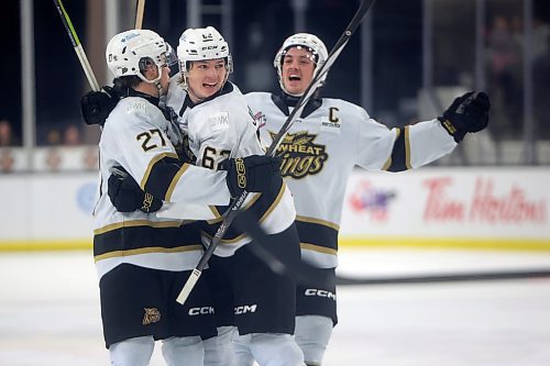 15112024
Luke Shipley #27, Nicholas Johnson #62 and Quinn Mantei #8 of the Brandon Wheat Kings celebrate a goal by Johnson during WHL action against the Regina Pats at Westoba Place on Friday evening. 
(Tim Smith/The Brandon Sun)