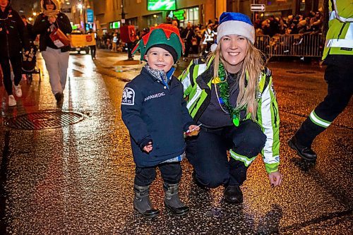 BROOK JONES/FREE PRESS
Laura Brown (right) and her three-year-old Son Gryffin, who is dressed as a junior paramedia, are pictured as part of the Winnipeg Fire Paradmedic Services parade entry in the Manitoba Hydro Santa Claus Parade in Winnipeg, Man., Saturday, Nov. 16, 2024.. The Santa Claus parade has run annually in Winnipeg since the former Eaton&#x2019;s department store organized the first one in 1909.