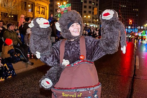 BROOK JONES/FREE PRESS
Katie Gorrill is dresssed as a Barrel of Monkeys as she waves to the crown while participating in the Manitoba Hydro Santa Claus Parade in Winnipeg, Man., Saturday, Nov. 16, 2024. The Santa Claus parade has run annually in Winnipeg since the former Eaton&#x2019;s department store organized the first one in 1909.