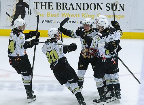 The Wheat Kings celebrate Rhett Ravndahl's second period goal against Regina Saturday night (Matt Packwood/The Brandon Sun)