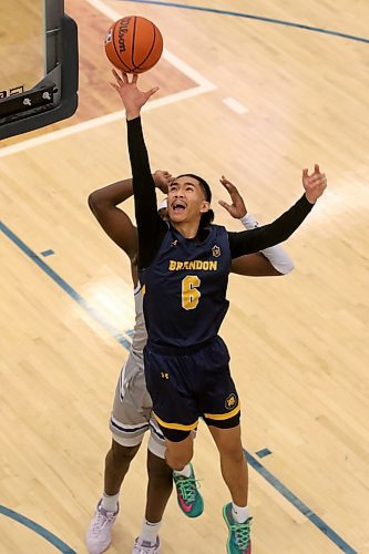 Brandon University's John Dayo drives against the Lethbridge Pronghorns in Canada West men's basketball at the Healthy Living Centre on Saturday. (Thomas Friesen/The Brandon Sun)