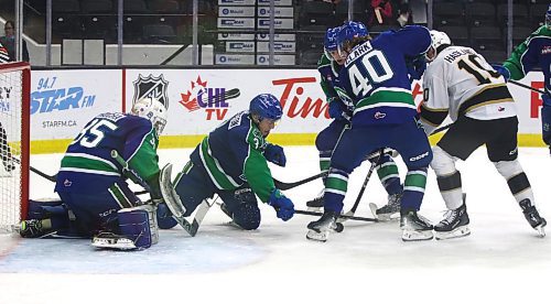 Swift Current Broncos Jack Clark (40) battles for the puck against Brandon Wheat Kings forward Caleb Hadland (10) along with his teammates Eric Johnston (3) and Parker Rondeau (17) in front of goalie Joey Rocha (35) in Western Hockey league action on Oct. 5 at Westoba Place. It was Clark&#x2019;s Manitoba debut in the WHL. (Perry Bergson/The Brandon Sun)