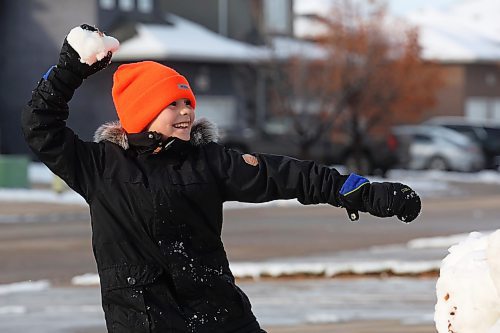 18112024
Harvey Reichert, nine, throws a snowball while enjoying a snowball fight with his sister, Amara, on Monday after Brandon&#x2019;s first snowfall on the weekend. The siblings built snow forts as well before their battle. Brandon is currently under a winter storm watch for Tuesday extending into Wednesday. 
(Tim Smith/The Brandon Sun)