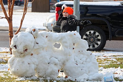 18112024
Harvey Reichert, nine, throws a snowball while enjoying a snowball fight with his sister, Amara, on Monday after Brandon&#x2019;s first snowfall on the weekend. Brandon is currently under a winter storm watch for Tuesday extending into Wednesday. 
(Tim Smith/The Brandon Sun)