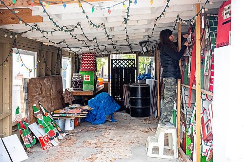 MIKAELA MACKENZIE / FREE PRESS
	
Jen de Delley unboards her Christmas elf village in her carport workshop in River Heights on Monday, Nov. 18, 2024.

For AV story.
Winnipeg Free Press 2024