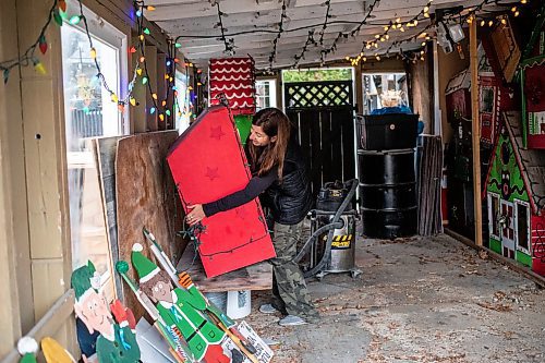 MIKAELA MACKENZIE / FREE PRESS
	
Jen de Delley takes her Christmas elf village out of storage in her carport workshop in River Heights on Monday, Nov. 18, 2024.

For AV story.
Winnipeg Free Press 2024