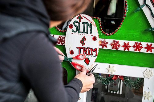 MIKAELA MACKENZIE / FREE PRESS
	
Jen de Delley re-glues items to the elf village&#x573; gym, which was damaged by a squirrel, in her carport workshop in River Heights on Monday, Nov. 18, 2024.

For AV story.
Winnipeg Free Press 2024