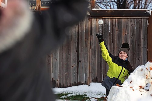 18112024
Amara Reichert throws a snowball while enjoying a snowball fight with her brother Harvey on Monday after Brandon&#x2019;s first snowfall on the weekend. The siblings built snow forts as well before their battle. Brandon is currently under a winter storm watch for Tuesday extending into Wednesday. 
(Tim Smith/The Brandon Sun)