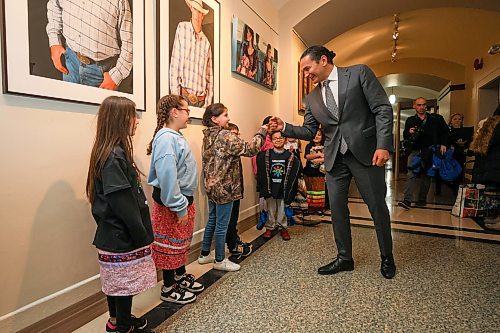 Mike Deal / Free Press
Athena Swampy, 9, fist bumps the Premier. 
Grade four students from the Ojibway bilingual program at Riverbend Community School meet with Premier Wab Kinew prior the speech from the&#xa0;throne where they will be singing the national anthem. 
241119 - Tuesday, November 19, 2024. 