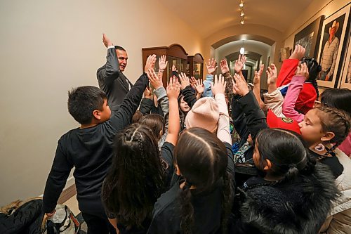 Mike Deal / Free Press
Premier Wab Kinew talks to Grade four students from the Ojibway bilingual program at Riverbend Community School prior to the speech from the throne where they will be singing the national anthem. 
241119 - Tuesday, November 19, 2024.