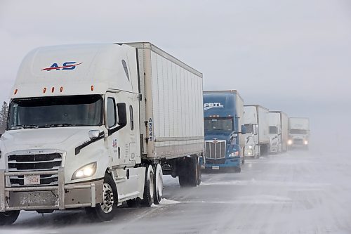 20112024
A long line of semi-trailers sit parked in the westbound lanes of the Trans Canada Highway at the turnoff to Souris after the Trans Canada Highway was closed from Griswold to the Saskatchewan border for part of Wednesday. The highway was also briefly closed from Brandon to Griswold due to the poor driving conditions. 
(Tim Smith/The Brandon Sun)