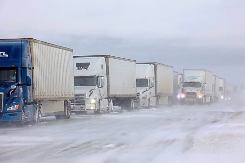 20112024
A long line of semi-trailers sit parked in the westbound lanes of the Trans Canada Highway at the turnoff to Souris after the Trans Canada Highway was closed from Griswold to the Saskatchewan border for part of Wednesday. The highway was also briefly closed from Brandon to Griswold due to the poor driving conditions. 
(Tim Smith/The Brandon Sun)