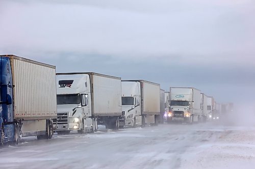 20112024
A long line of semi-trailers sit parked in the westbound lanes of the Trans Canada Highway at the turnoff to Souris after the Trans Canada Highway was closed from Griswold to the Saskatchewan border for part of Wednesday. The highway was also briefly closed from Brandon to Griswold due to the poor driving conditions. 
(Tim Smith/The Brandon Sun)