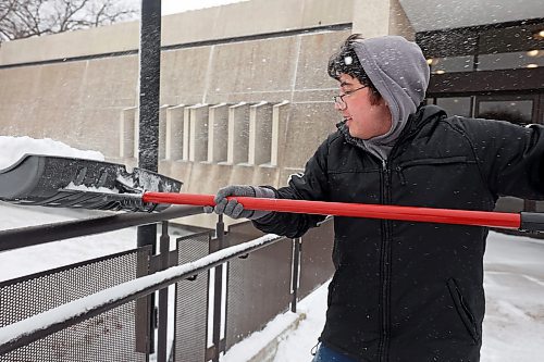 20112024
Nathaniel Delbridge shovels snow from the steps of the Western Manitoba Centennial Auditorium on Wednesday after a winter storm blanketed westman in snow and ice overnight. 
(Tim Smith/The Brandon Sun)