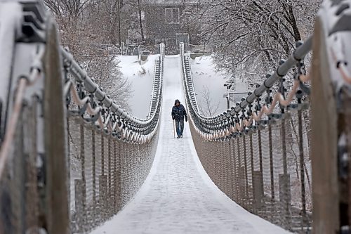 20112024
A bundled up man walks across the snow and ice covered Souris Swinging Bridge during flurries on Wednesday afternoon.(Tim Smith/The Brandon Sun)