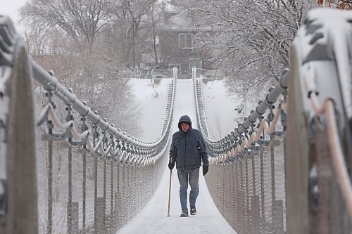 20112024
A bundled up man walks across the snow and ice covered Souris Swinging Bridge during flurries on Wednesday afternoon.(Tim Smith/The Brandon Sun)