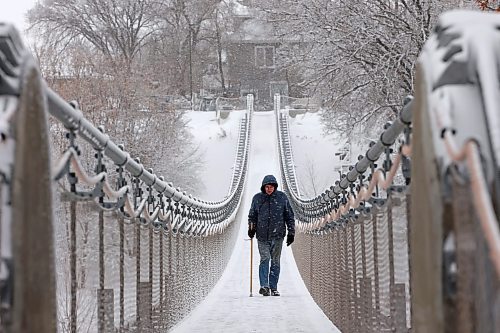 20112024
A bundled up man walks across the snow and ice covered Souris Swinging Bridge during flurries on Wednesday afternoon.(Tim Smith/The Brandon Sun)