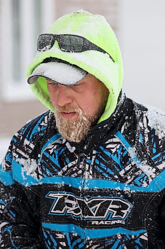 20112024
Snow clings to Trysten Jefferies&#x2019; beard as he uses a snowblower to clear snow from in front of his home in Souris during flurries on Wednesday afternoon. An overnight winter storm blanketed Westman in snow.  (Tim Smith/The Brandon Sun)