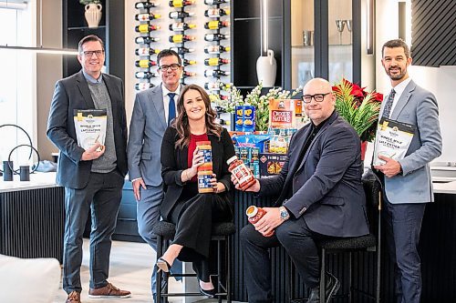 MIKAELA MACKENZIE / FREE PRESS
	
Moore Group realtors David Van Benthem (left), Reid Boles, Stephanie Baron, Scott Moore, and Phil Gear in one of their show homes on Wednesday, Nov. 20, 2024. The group is gearing up for its eighth annual food drive in support of William Whyte School, a Kindergarten to Grade 8 school in the North End.

For Aaron story.
Winnipeg Free Press 2024