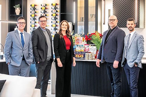 MIKAELA MACKENZIE / FREE PRESS
	
Moore Group realtors Reid Boles (left), David Van Benthem, Stephanie Baron, Scott Moore, and Phil Gear in one of their show homes on Wednesday, Nov. 20, 2024. The group is gearing up for its eighth annual food drive in support of William Whyte School, a Kindergarten to Grade 8 school in the North End.

For Aaron story.
Winnipeg Free Press 2024