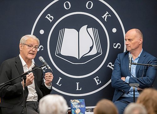 BROOK JONES/FREE PRESS
McNally Robinson hosts an Evening with Marc Garneau in Winnipeg, Man., Wednesday, Nov. 20, 2024. Pictured: Canada's first man in space Garneau (left) talks with Free Press Editor Paul Samyn about his life experiences as astronaut and Liberal MP. Garneau was in Winnipeg to talk about his memoir A Most Extraordinary Ride: Space, Politics, and the Pursuit of a Canadian Dream published in early October of 2024 by McClelland &amp; Stewart.