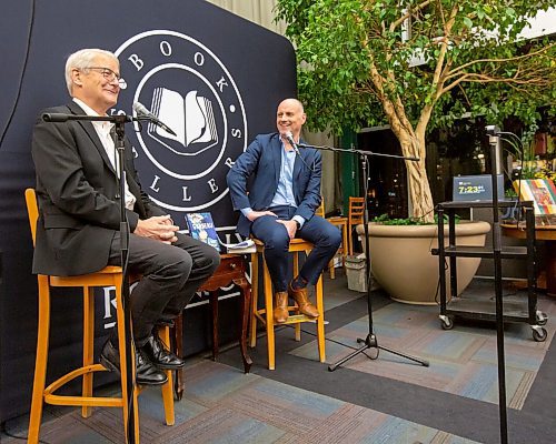 BROOK JONES/FREE PRESS
McNally Robinson hosts an Evening with Marc Garneau in Winnipeg, Man., Wednesday, Nov. 20, 2024. Pictured: Canada's first man in space Garneau (left) and Free Press Editor Paul Samyn share smiles during a conversation hosted by Paul Samyn in which Garneau talked about his experiences as an astronaut and also a Liberal MP. Garneau was in Winnipeg to talk about his memoir A Most Extraordinary Ride: Space, Politics, and the Pursuit of a Canadian Dream published in early October of 2024 by McClelland &amp; Stewart.