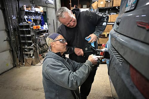 RUTH BONNEVILLE / FREE PRESS

BIZ - Mitchell Welding

Photos of the shop's only two employees: Don Jones (hat), and Mark Nichols ( Ed's younger brother), working.

Ed Nichols, owner of  Mitchell Welding, a 128-year-old company that specializes in trailer hitch installation and repair that he took over from his father-in-law.  

Story by Aaron
Nov. 22 'Made in Manitoba' article 

Nov  20th, 2024