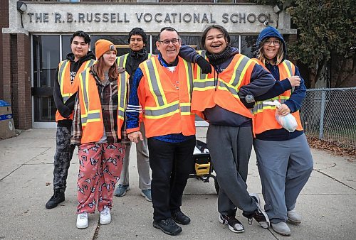 RUTH BONNEVILLE / FREE PRESS

LOCAL - school/bear clan

Photo of RB Russell teacher, Will Jones, with some students that are taking part in the Bear Clan Club, outside the school Thursday.  

Jones along with a group of high school students take part in walks in the community with the Bear Clan,

See story by Maggie


Nov  21st, 2024