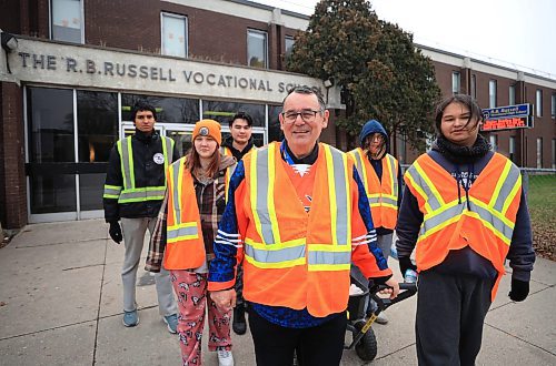 RUTH BONNEVILLE / FREE PRESS

LOCAL - school/bear clan

Photo of RB Russell teacher, Will Jones, with some students that are taking part in the Bear Clan Club, outside the school Thursday.  

Jones along with a group of high school students take part in walks in the community with the Bear Clan,

See story by Maggie


Nov  21st, 2024