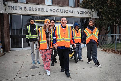 RUTH BONNEVILLE / FREE PRESS

LOCAL - school/bear clan

Photo of RB Russell teacher, Will Jones, with some students that are taking part in the Bear Clan Club, outside the school Thursday.  

Jones along with a group of high school students take part in walks in the community with the Bear Clan,

See story by Maggie


Nov  21st, 2024