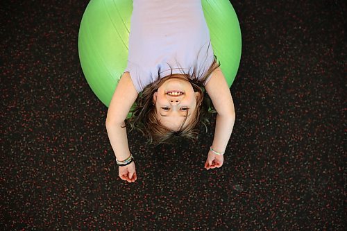 21112024
&#xc9;cole New Era School grade four student Aria Gergert stretches on an exercise ball at the YMCA of Brandon during a YMCA Enrichment Program noon-hour workout with other New Era students on Thursday. The pilot program currently involves 8 students from New Era ranging from grades 2-8 and is meant for students who benefit from more movement and activity throughout their school day. New Era counsellor Karl McDaniel and french immersion teachers Louise Roberts and Ellen Murray accompany the students to the YMCA three days a week and go through workouts with the kids.  (Tim Smith/The Brandon Sun)